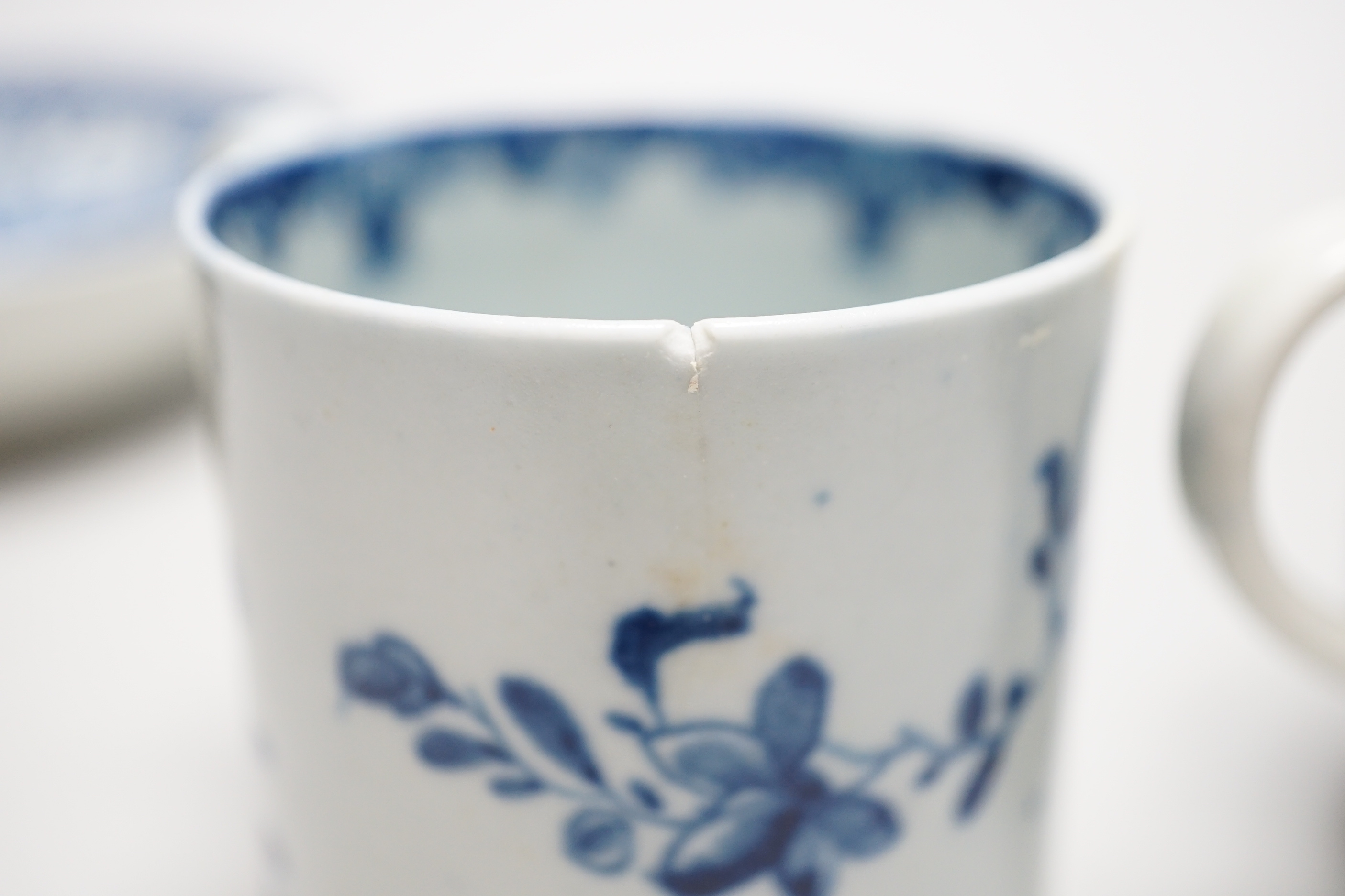 Two Worcester coffee cans, Mansfield and Three Flowers patterns, and a Worcester/Caughley coffee cup and saucer, Fisherman and Cormorant pattern